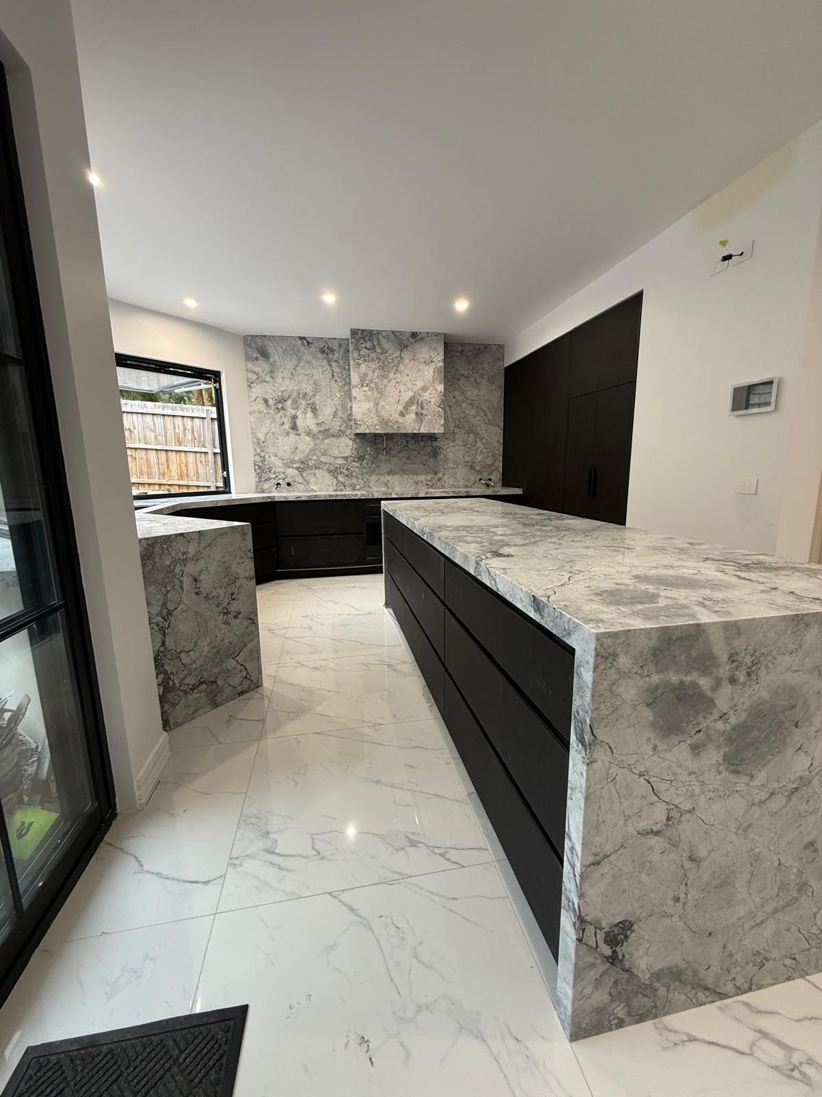 Super White Dolomite kitchen island and waterfall end completed by StoneMart